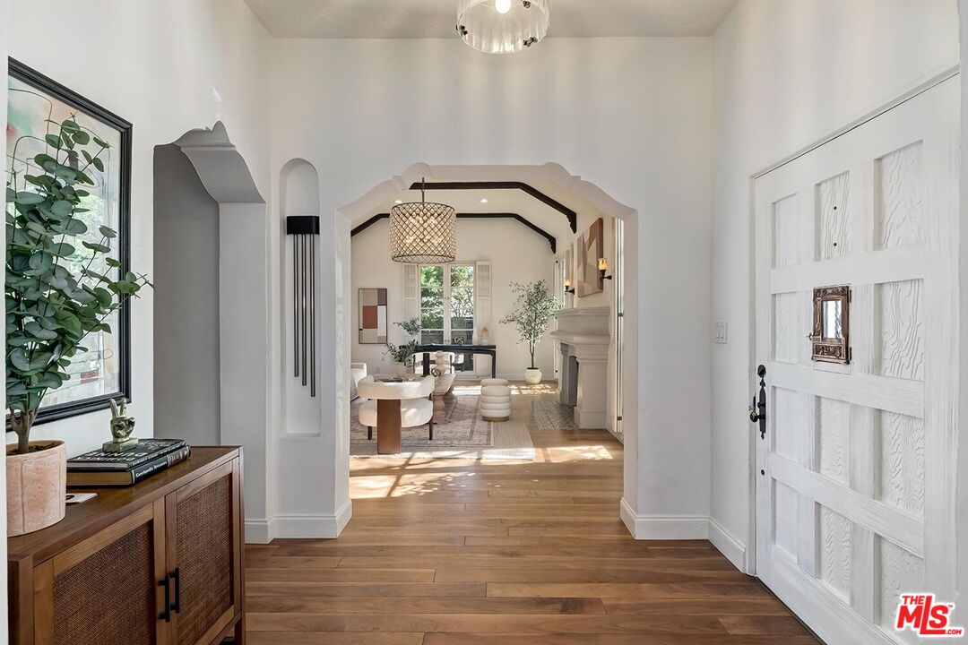 384 North Bonhill Road Los Angeles, CA 90049 - Photo 3 of 32 a view of a livingroom with furniture hardwood floor and a living room