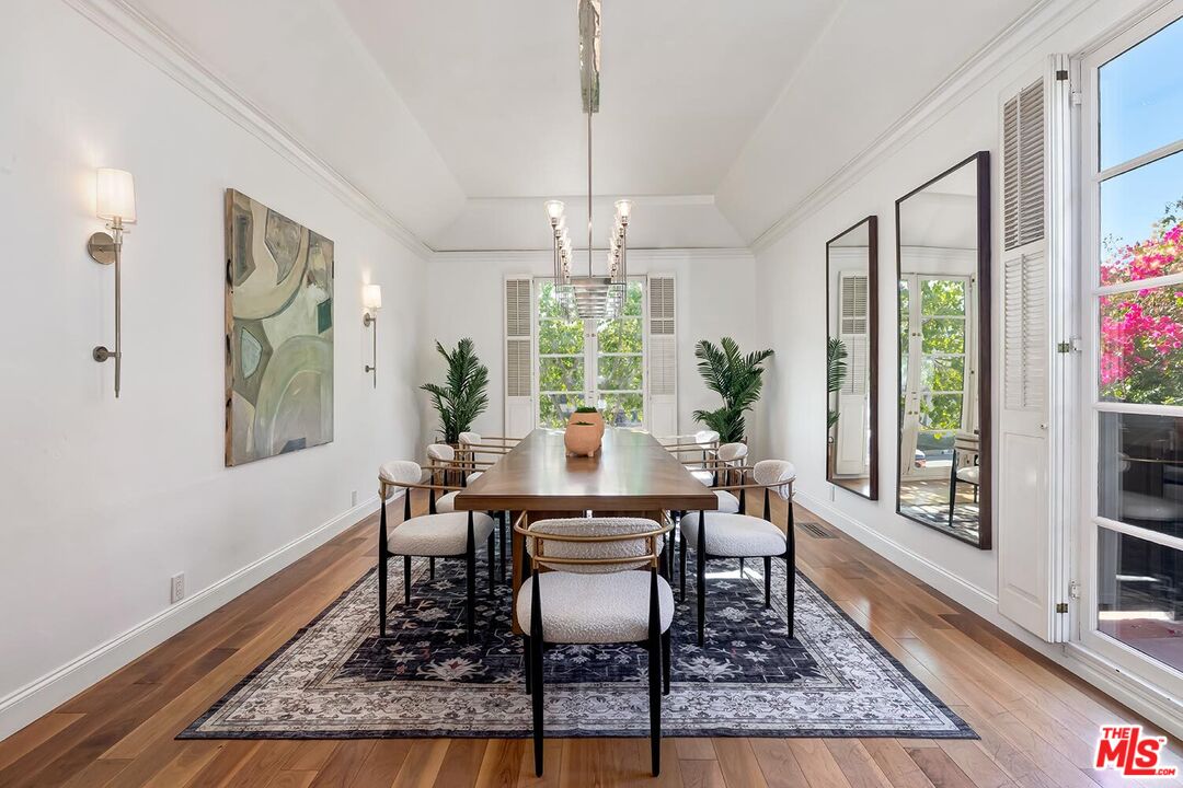 384 North Bonhill Road Los Angeles, CA 90049 - Photo 9 of 32 a dining room with furniture a rug and wooden floor
