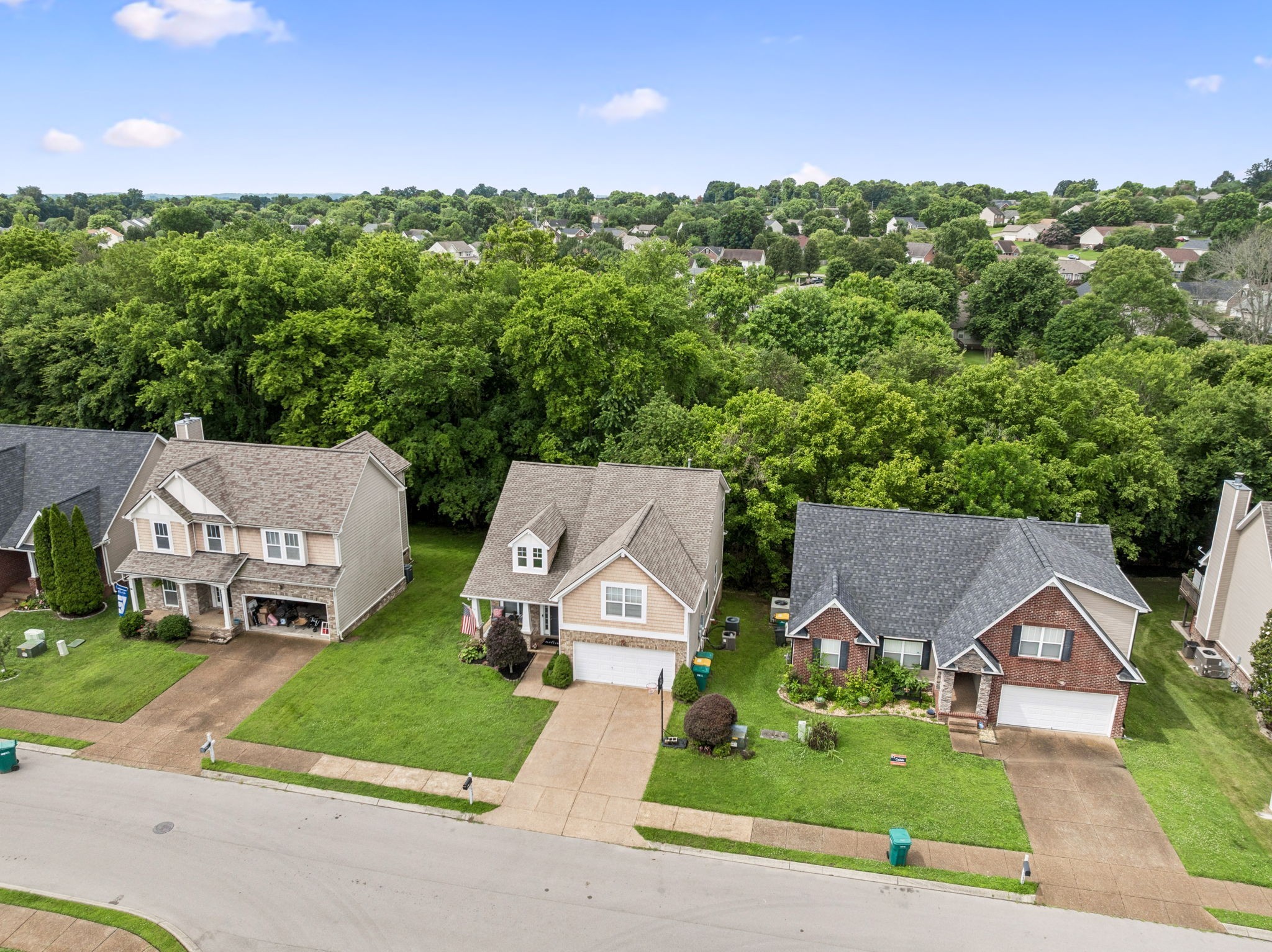 1443 Bern Drive Spring Hill, TN 37174 - Photo 2 of 64 an aerial view of a house with a garden and trees