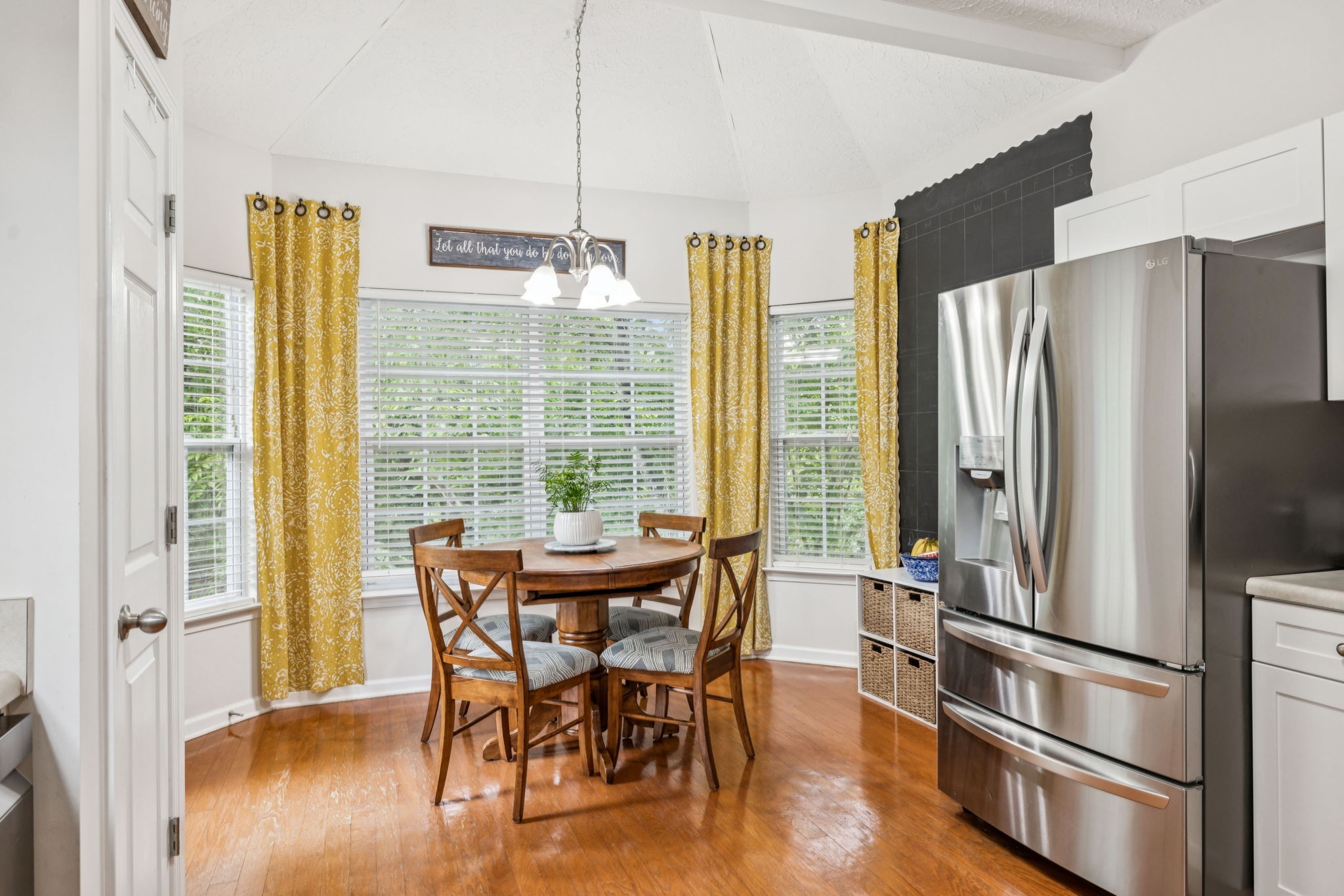 1443 Bern Drive Spring Hill, TN 37174 - Photo 25 of 64 a kitchen with stainless steel appliances a dining table chairs and chandelier