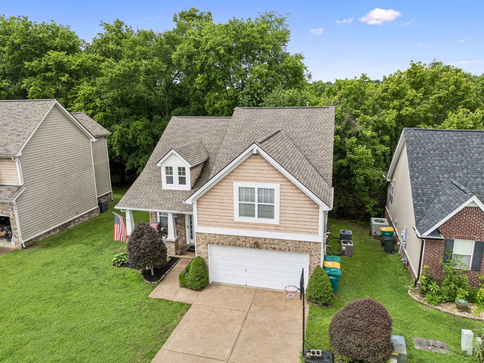 1443 Bern Drive Spring Hill, TN 37174 - Photo 4 of 64 a front view of a house with a yard and garage
