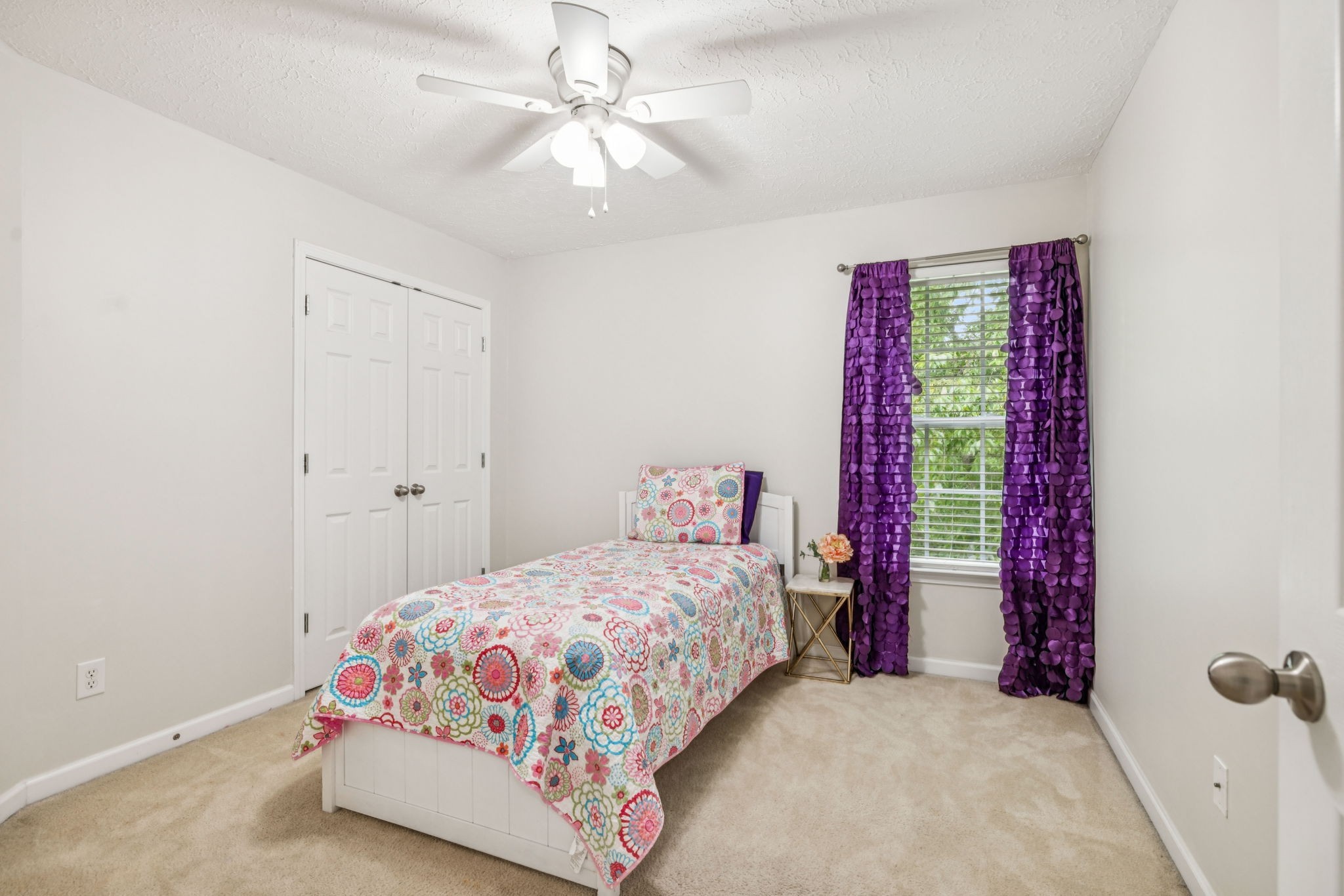 1443 Bern Drive Spring Hill, TN 37174 - Photo 44 of 64 a bedroom with a bed and a chandelier