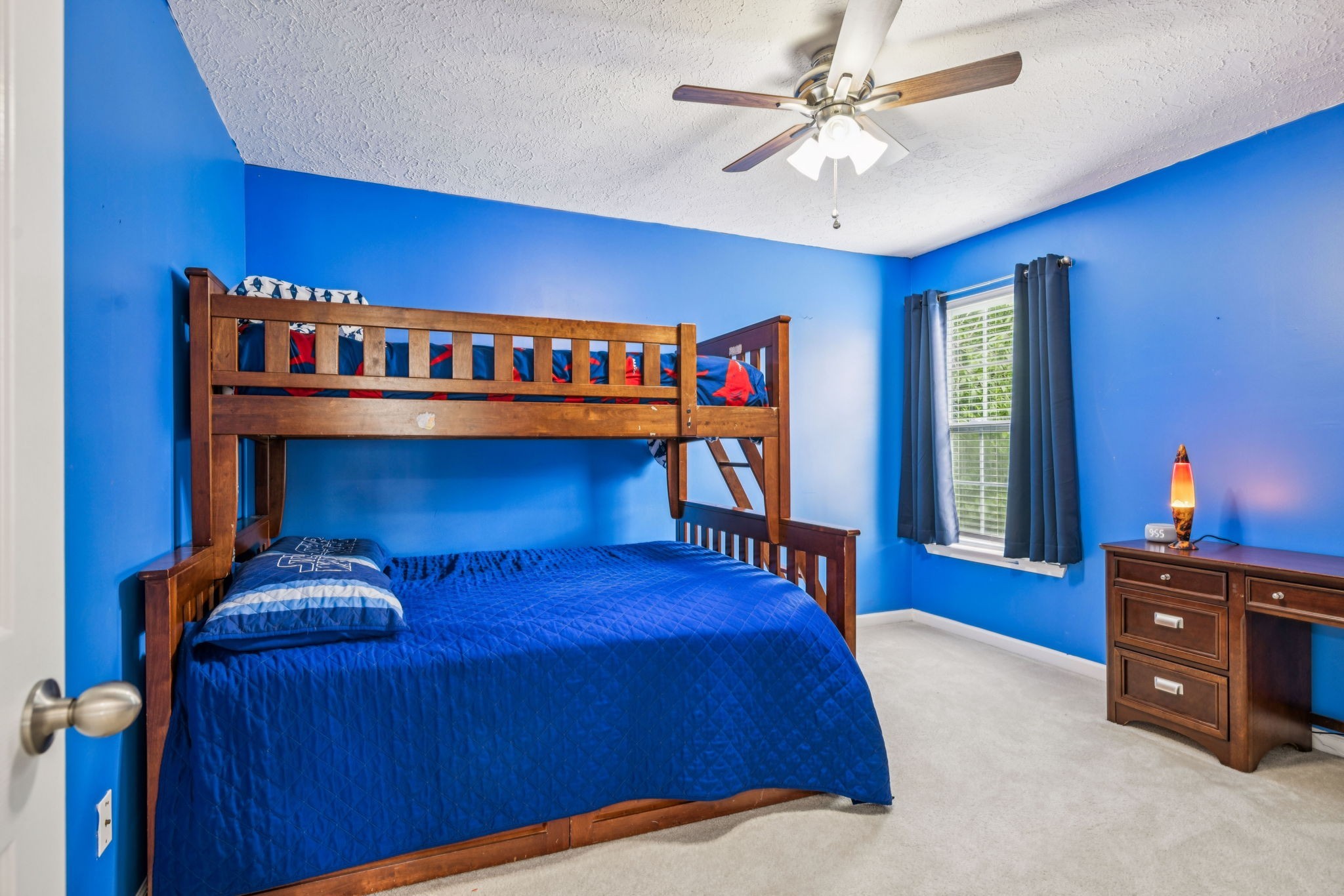 1443 Bern Drive Spring Hill, TN 37174 - Photo 45 of 64 a bedroom with a bed and a chandelier