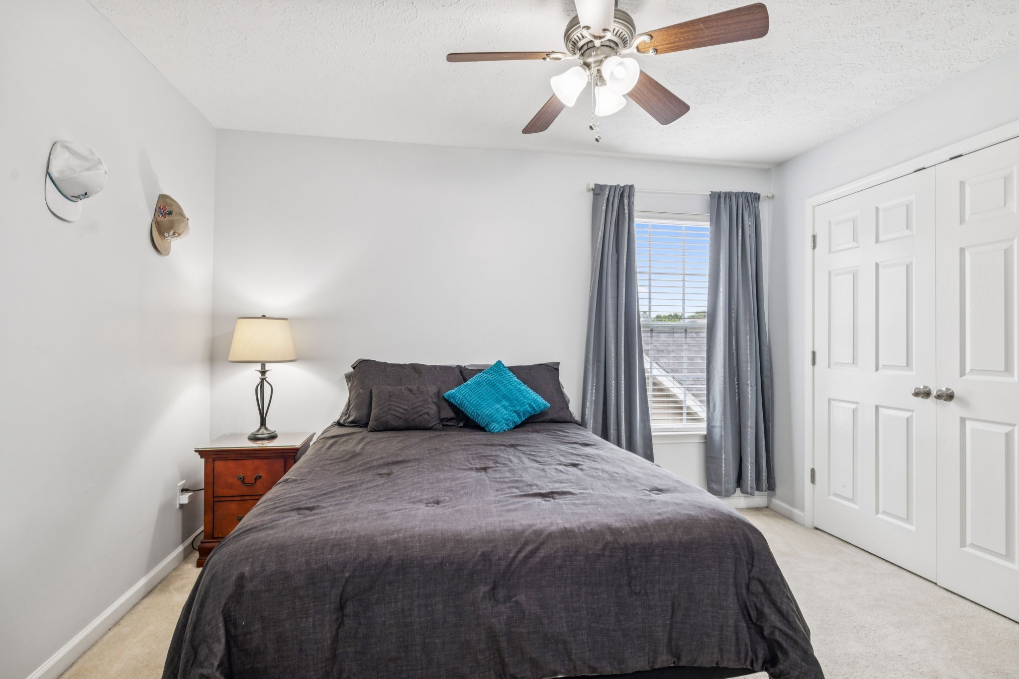 1443 Bern Drive Spring Hill, TN 37174 - Photo 47 of 64 a bedroom with a bed and a chandelier