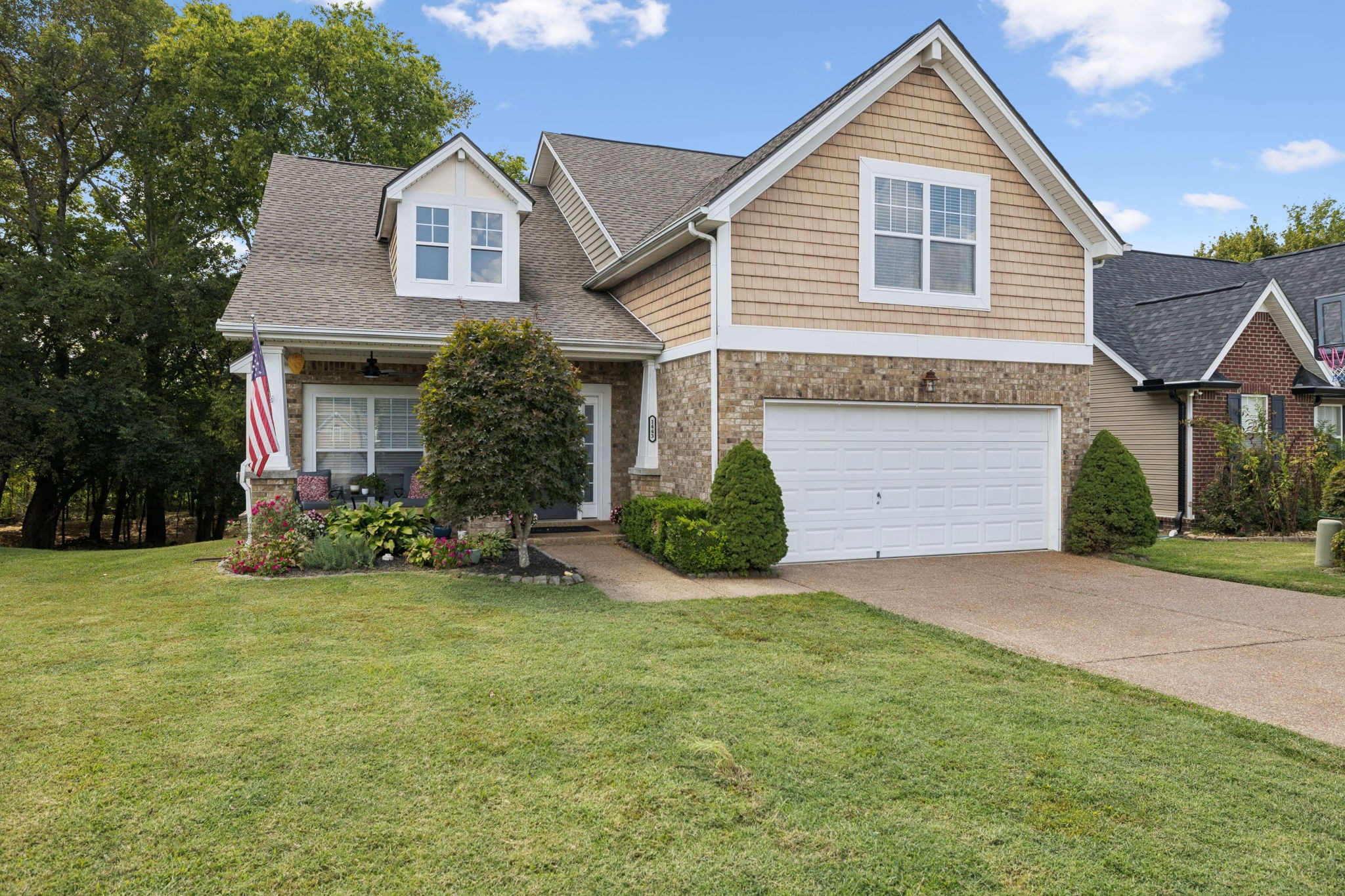 1443 Bern Drive Spring Hill, TN 37174 - Photo 5 of 64 a front view of a house with a yard and garage