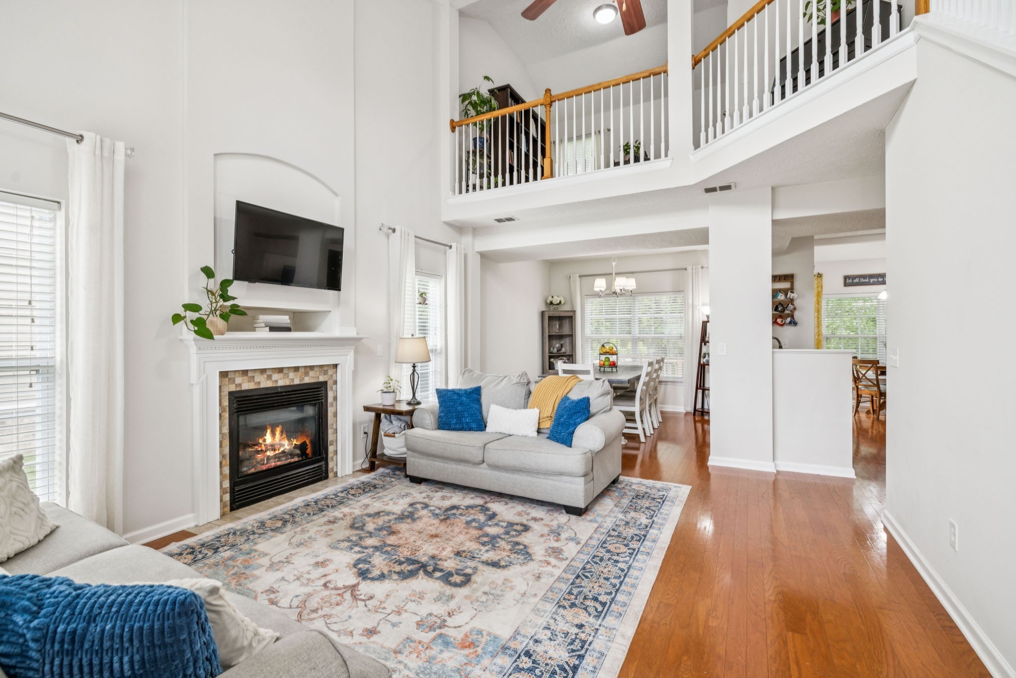 1443 Bern Drive Spring Hill, TN 37174 - Photo 10 of 64 a living room with furniture a fireplace and a flat screen tv