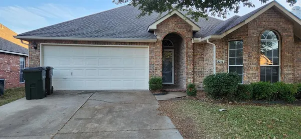 a front view of a house with garage