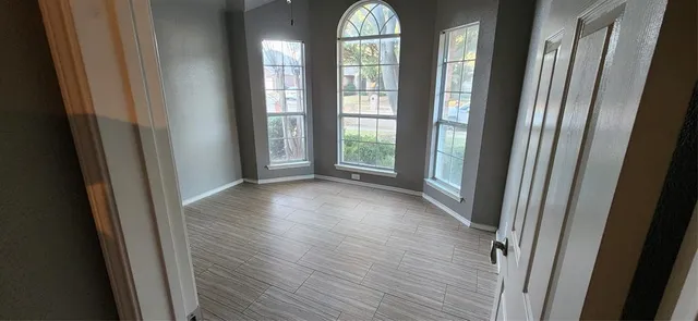 a view of entryway with wooden floor