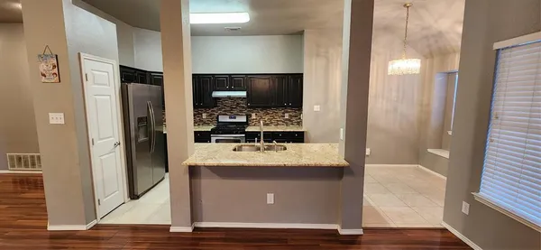 a room with a table and chairs