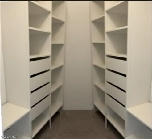 a view of kitchen with furniture and wooden floor