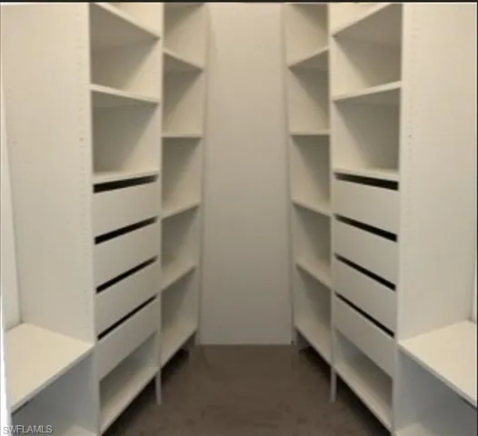 a view of kitchen with furniture and wooden floor