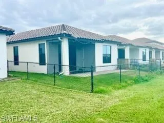 a bathroom with a granite countertop shower sink and mirror