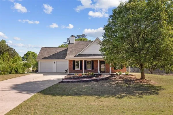 a front view of a house with a yard