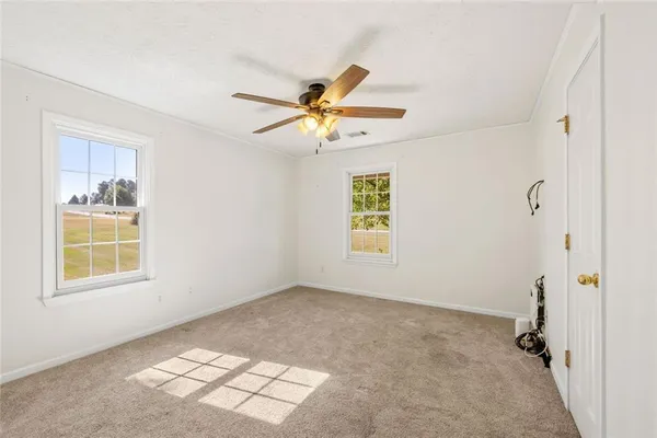 a view of an empty room with a window