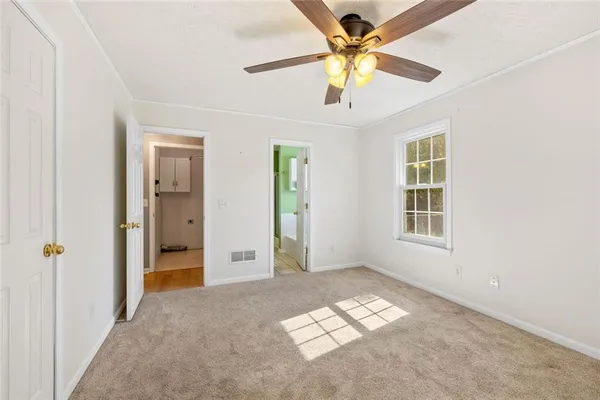 a view of an empty room with a window