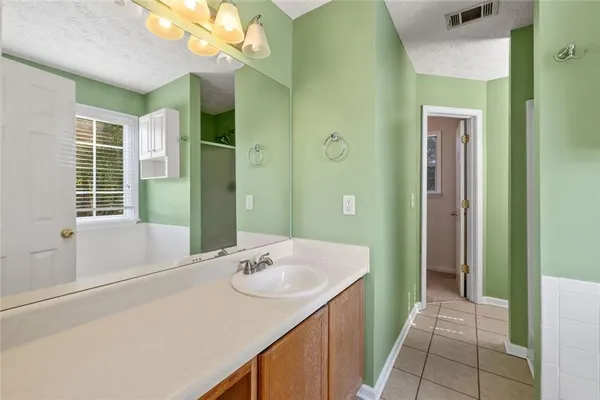 a bathroom with a sink a vanity and a mirror
