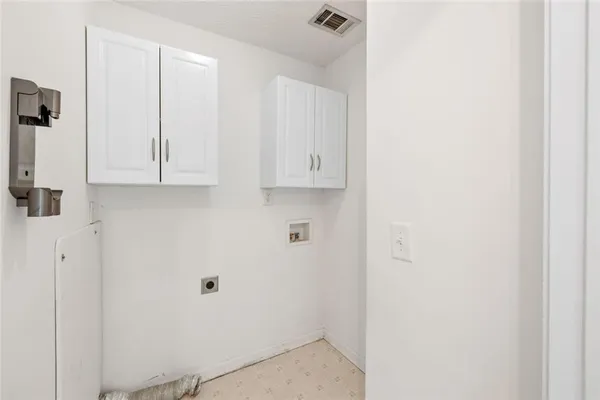 a view of cabinets and wooden floor