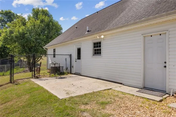 a view of a backyard of the house
