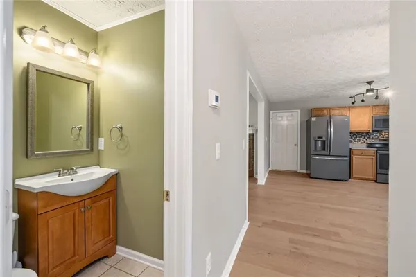a bathroom with a sink a mirror and a shower
