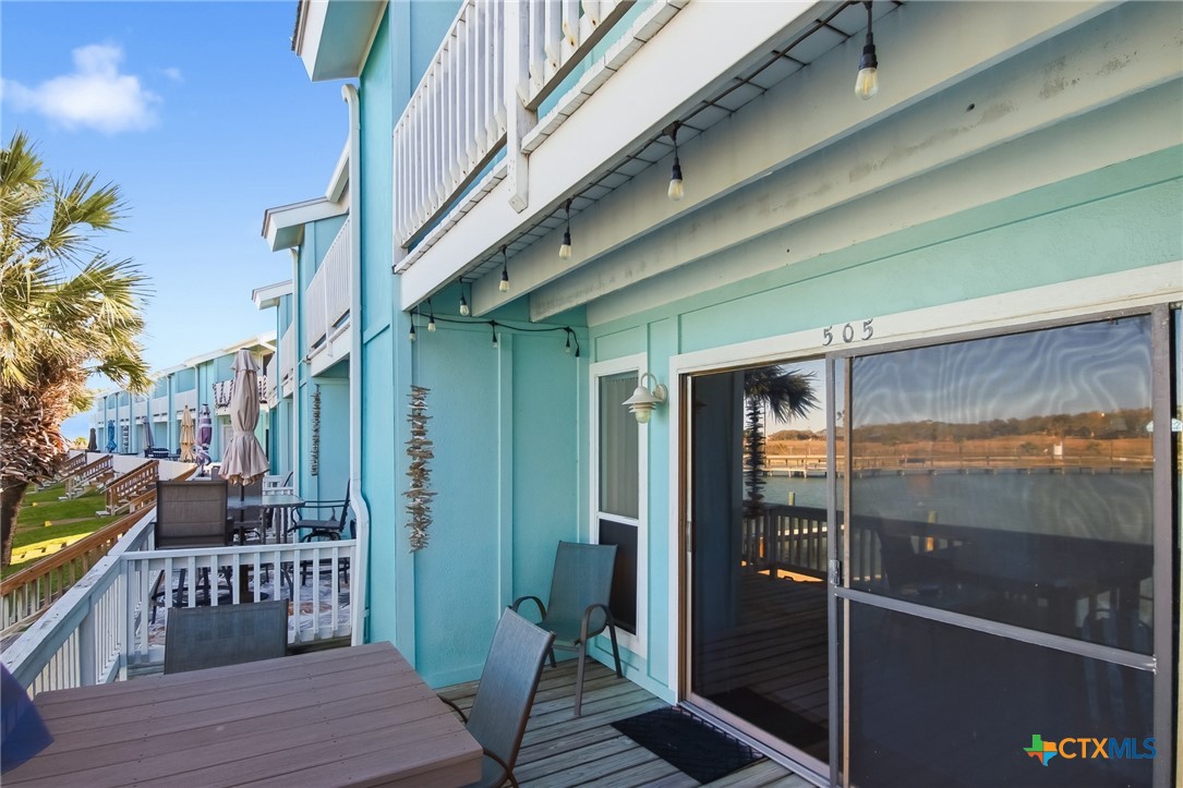 2292 North Fulton Beach Road, Unit 505 Rockport, TX 78382 - Photo 32 of 46 a porch with seating space