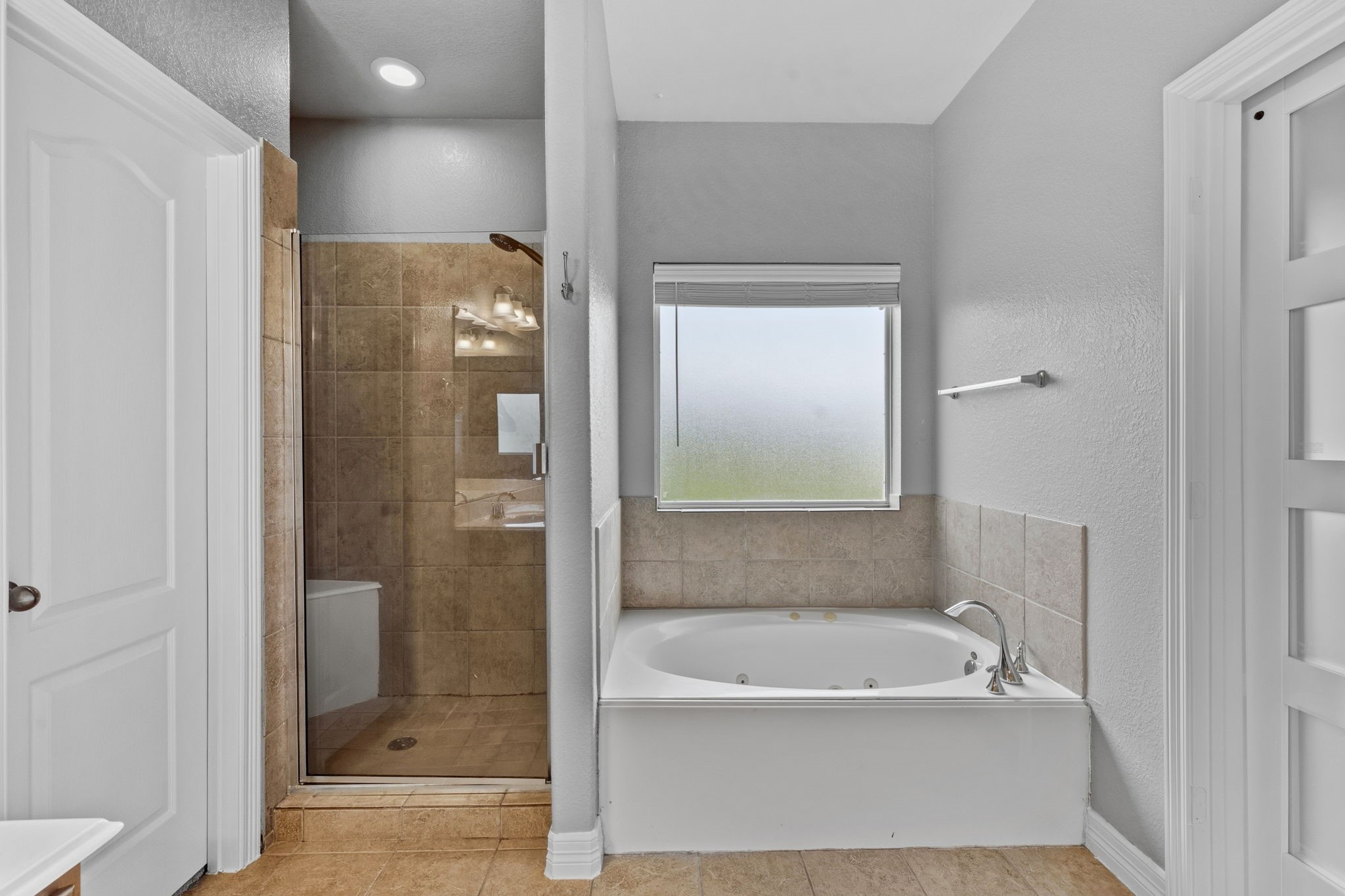 1405 Big Hill Road Winnie, TX 77665 - Photo 35 of 43 a bathroom with a bathtub and a shower