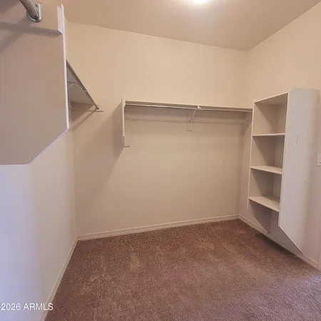 a view of an empty walk in closet