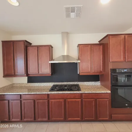 a kitchen with granite countertop cabinets and sink