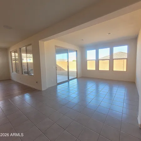 a view of an empty room with glass door