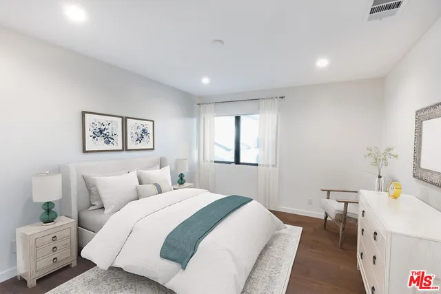 a bedroom with a bed and a view of bathroom