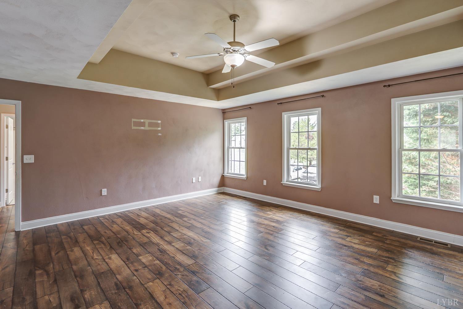 1057 Old Trail Road Forest, VA 24551 - Photo 28 of 49 a view of an empty room with wooden floor and a window