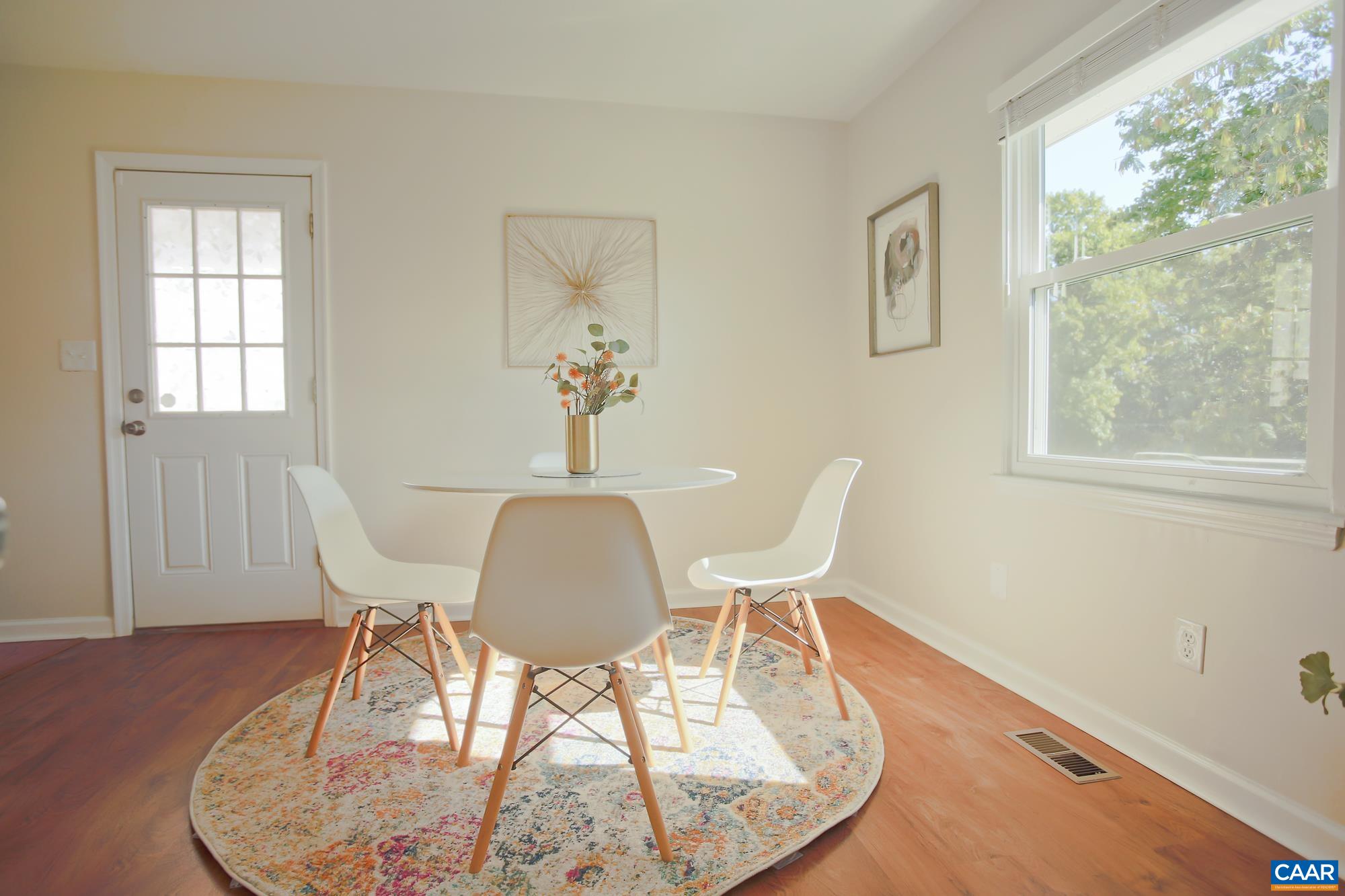 814 Raymond Road Charlottesville, VA 22902 - Photo 10 of 26 a view of a dining room with furniture a rug and wooden floor