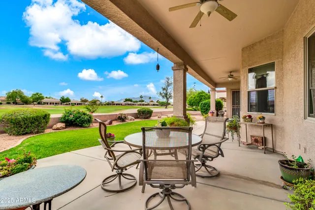 a view of a patio with a table chairs and a table