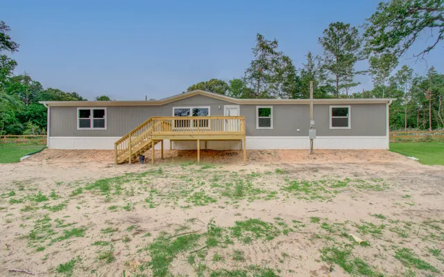 a house with trees in the background