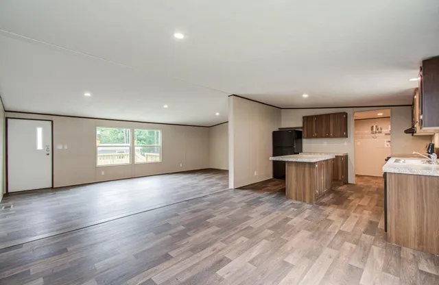 a view of kitchen with furniture and wooden floor