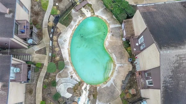 an aerial view of a swimming pool