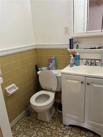 a bathroom with a toilet a sink and a shower