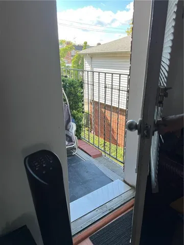 a view of balcony with furniture