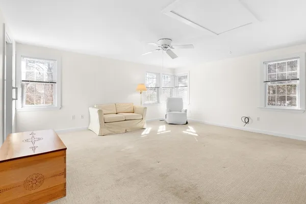 a living room with furniture and window