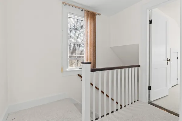 a view of a hallway with a window
