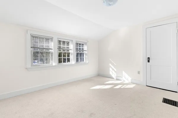 a view of empty room with windows