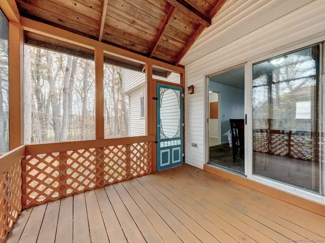 a view of front door with wooden floor