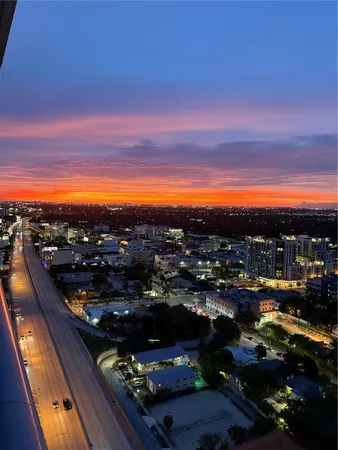 a swimming pool with outdoor seating and barbeque oven