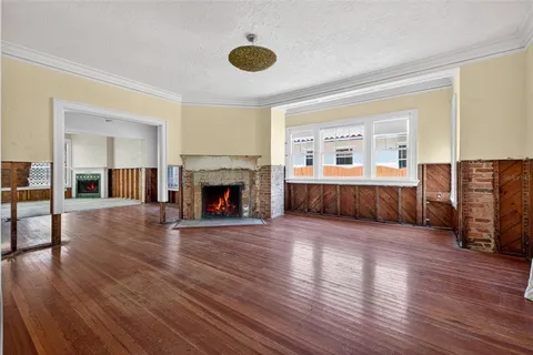 a view of livingroom with hardwood floor and a fireplace