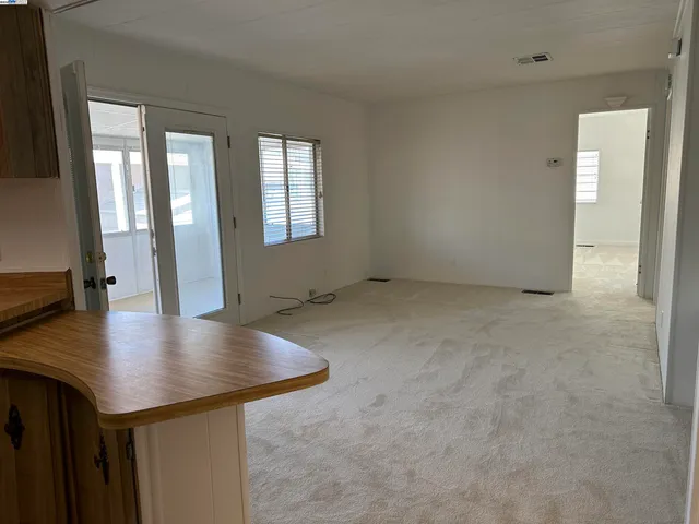 a view of a kitchen and a window