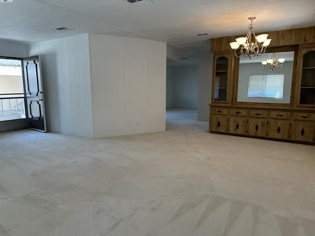 a kitchen with stainless steel appliances granite countertop a sink and a stove