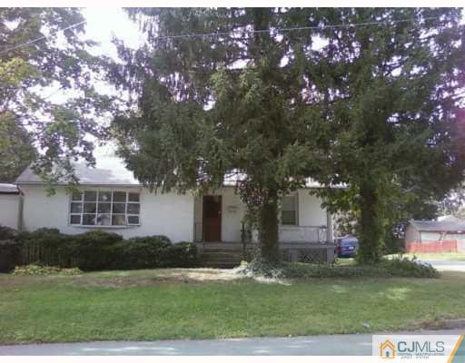 50 Meadow Road Edison, NJ 08817 - Photo 1 of 6 a front view of a house with a garden