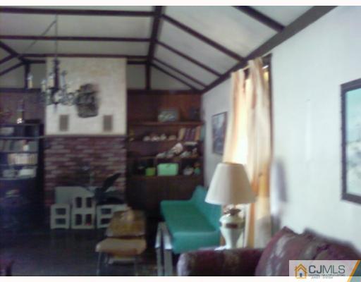 50 Meadow Road Edison, NJ 08817 - Photo 2 of 6 a living room with furniture and a window