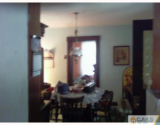 50 Meadow Road Edison, NJ 08817 - Photo 4 of 6 a view of a workspace room with furniture and wooden floor