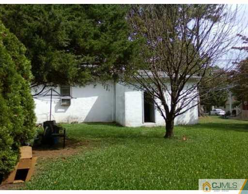 50 Meadow Road Edison, NJ 08817 - Photo 5 of 6 a front view of a house with a yard