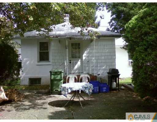 50 Meadow Road Edison, NJ 08817 - Photo 6 of 6 a front view of a house with a garden and patio